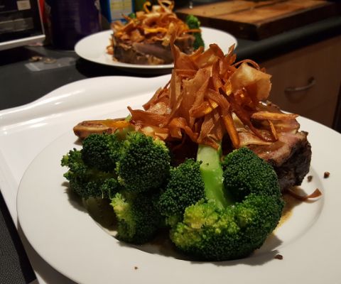 Rib eye steak with broccolini and sweet potato chips